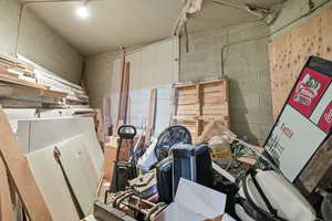 Misc room featuring concrete block wall