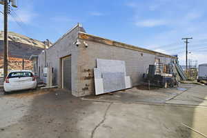 View of outbuilding featuring a garage and driveway