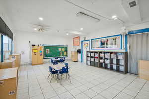 Dining area featuring ceiling fan, recessed lighting, and light tile patterned flooring