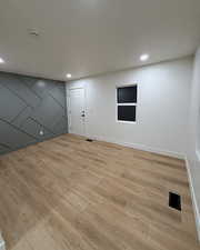Large living/family room with custom wall and LVP flooring