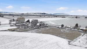 Snowy aerial view featuring a mountain view