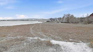 View of yard with a rural view