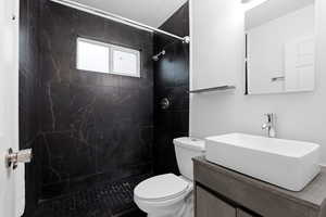 Full bath with vanity and a stall shower