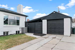 Detached garage with concrete driveway