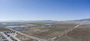 Aerial view of a mountain backdrop and an industrial area