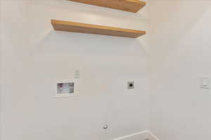 Laundry area featuring hookup for a washing machine and electric dryer hookup