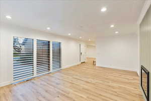 Spare room with light wood-style flooring and recessed lighting