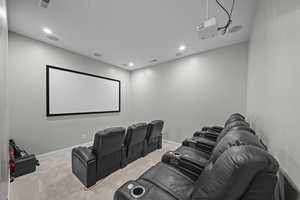 Home theater room featuring recessed lighting and light carpet