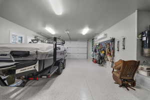 Garage with a central vacuum unit and a wall unit AC