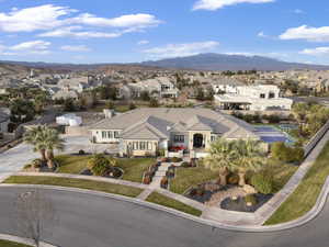 Aerial perspective of suburban area featuring a mountain backdrop