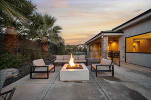 View of patio / terrace featuring an outdoor living space with a fire pit