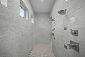 Full bath with tiled shower