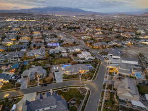 Aerial view at dusk of a residential view and a mountain view