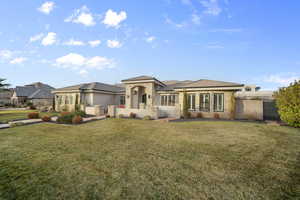 View of front of home featuring a gate, stone siding, stucco siding, and a tiled roof