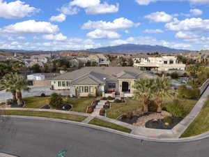 View of front facade featuring a residential view, a mountain view, and a front lawn