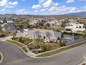 Aerial perspective of suburban area featuring a mountainous background