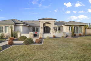 View of front of home with stone siding and stucco siding