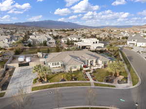 Aerial view of residential area featuring a mountainous background