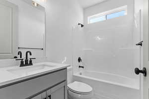 Full bath with shower / bath combination and vanity