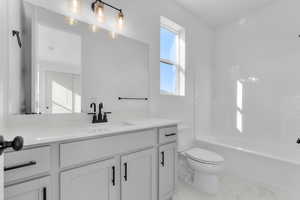 Full bath with shower / washtub combination and vanity