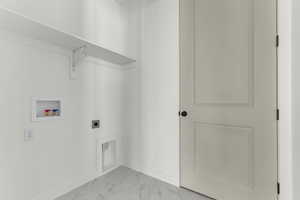 Laundry room with hookup for a washing machine, marble finish floors, and hookup for an electric dryer
