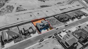 Aerial view of residential area featuring property boundaries highlighted