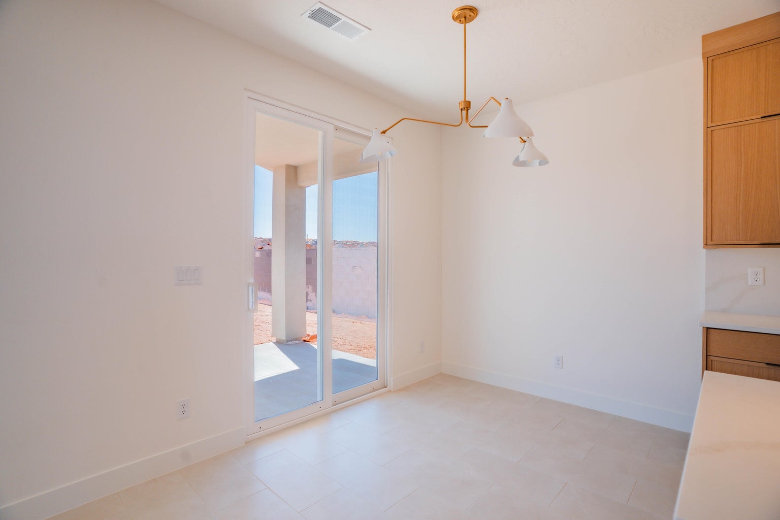 Unfurnished dining area featuring baseboards