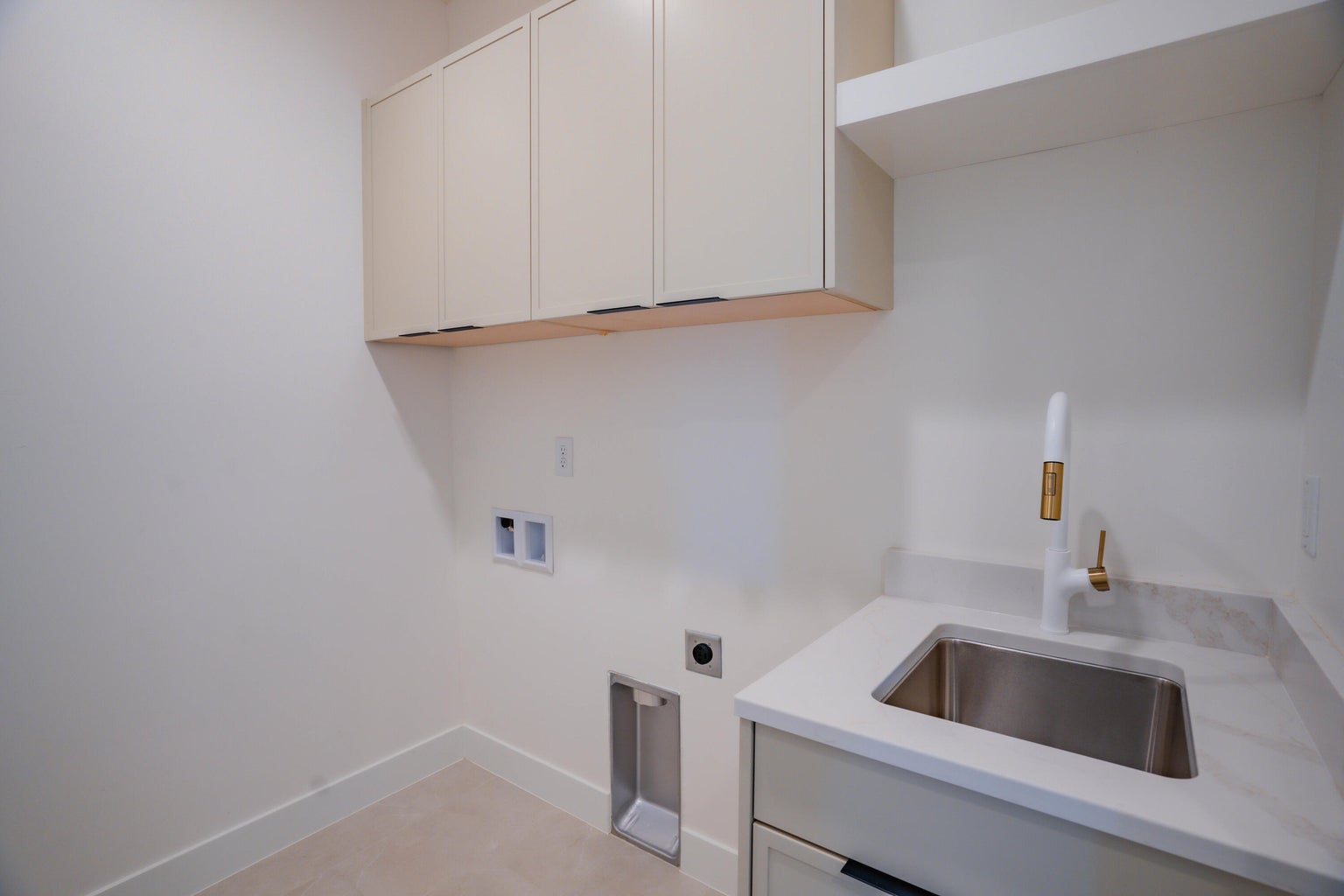 Laundry area featuring hookup for a washing machine, electric dryer hookup, and cabinet space