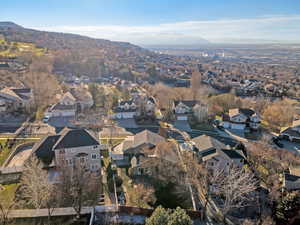 Aerial overview of property's location featuring nearby suburban area and a mountain backdrop