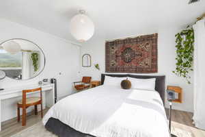 Bedroom featuring a closet and light wood-type flooring