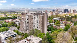 View of building exterior featuring a city view and a mountain view