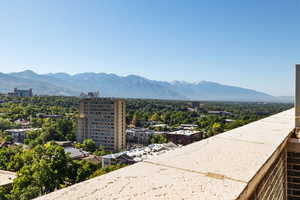 View of mountain background featuring nearby urban area