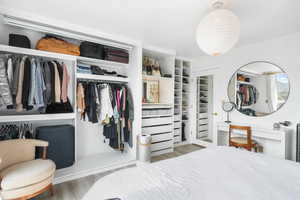 Bedroom with a closet and wood finished floors