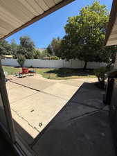 Fenced backyard featuring a patio area