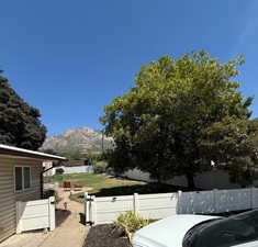 View of yard with a mountain view and a patio
