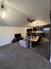 Living area featuring an office area, lofted ceiling, and ceiling fan