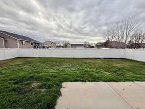 Fenced backyard with a residential view