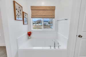 Featuring this pristine soaking tub