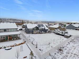 Snowy aerial view with a residential view