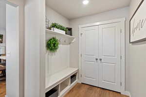 Mudroom featuring light wood-type flooring