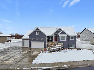 View of front of home featuring driveway and board and batten siding