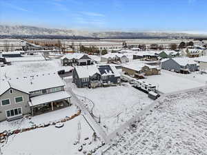Snowy aerial view with a residential view