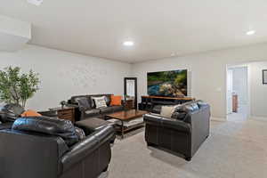 Living room featuring light carpet and recessed lighting