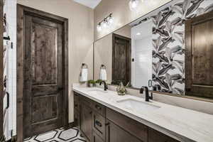 Bathroom featuring double vanity