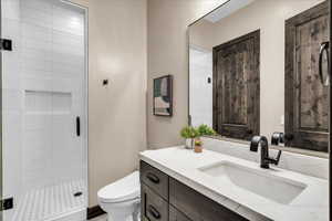 Bathroom with vanity and a shower stall