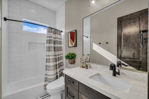 Full bath with vanity and shower / bathtub combination with curtain