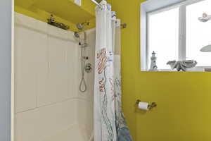 Full bath featuring curtained shower