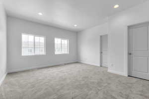 Unfurnished room featuring light colored carpet and recessed lighting