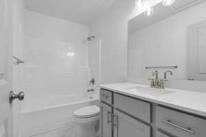 Bathroom featuring shower / bathtub combination and vanity