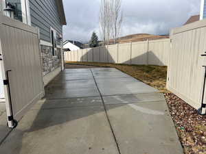 Fenced backyard with a patio area